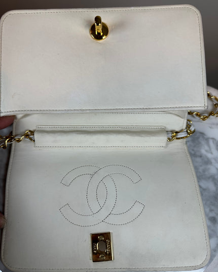 Sold!! Chanel cream quilted calfskin leather flap turn lock WOC crossbody bag