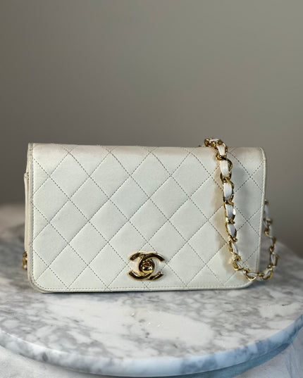 Sold!! Chanel cream quilted calfskin leather flap turn lock WOC crossbody bag