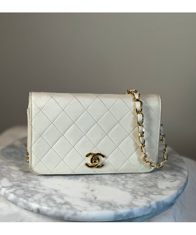 Sold!! Chanel cream quilted calfskin leather flap turn lock WOC crossbody bag