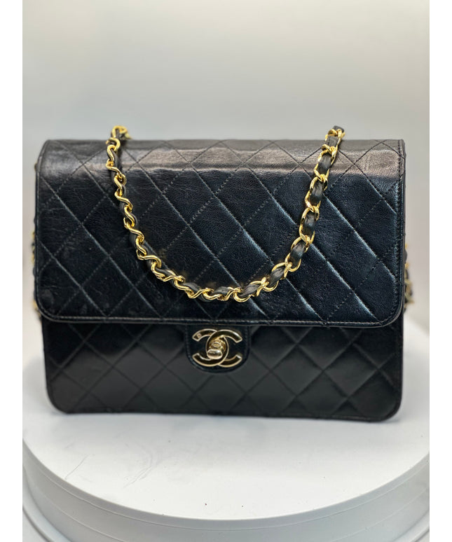 Sold!!  Chanel quilted black leather Flap crossbody with 24K turn lock and Chain