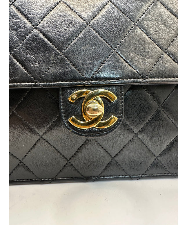 Sold!!  Chanel quilted black leather Flap crossbody with 24K turn lock and Chain
