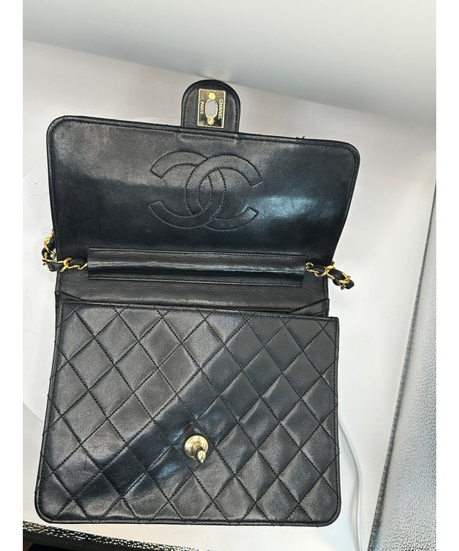 Sold!!  Chanel quilted black leather Flap crossbody with 24K turn lock and Chain