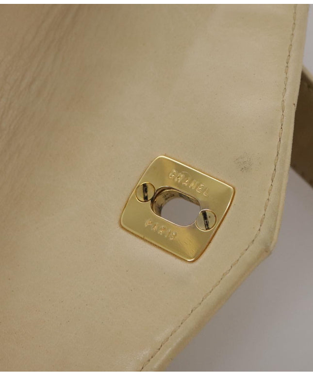Chanel tan quilted belt turn lock bag with crossbody strap