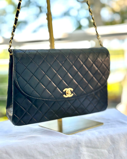 Chanel black leather flap turnlock bag