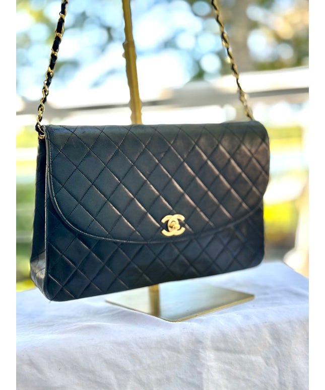 Chanel black leather flap turnlock bag