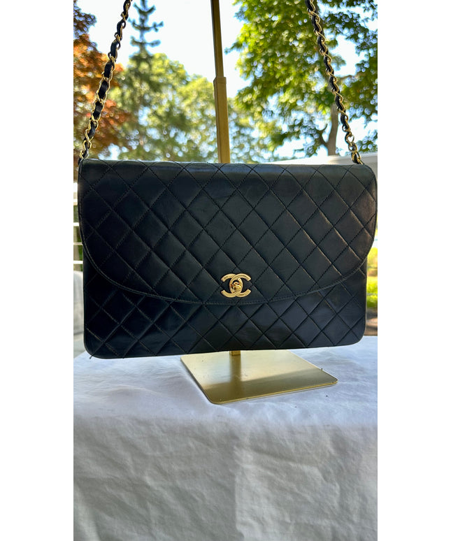 Chanel black leather flap turnlock bag