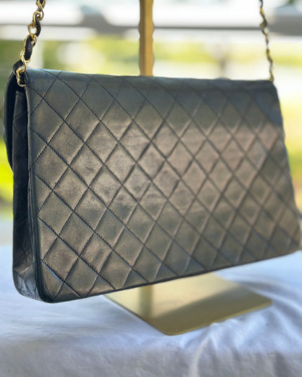 Chanel black leather flap turnlock bag