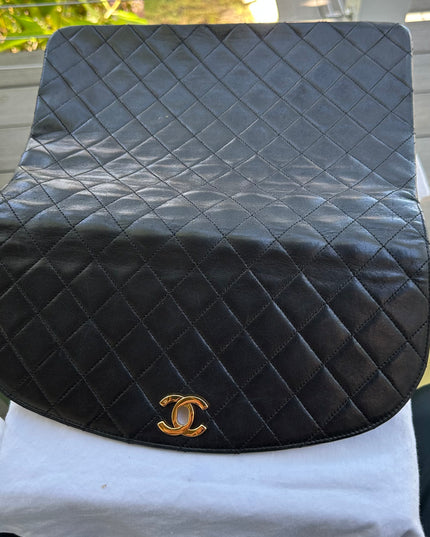 Chanel black leather flap turnlock bag