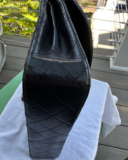 Chanel black leather flap turnlock bag