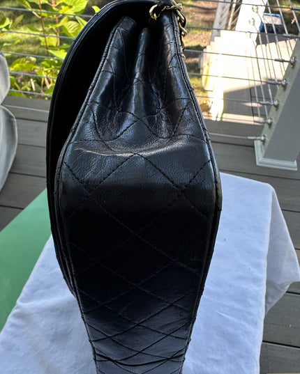 Chanel black leather flap turnlock bag