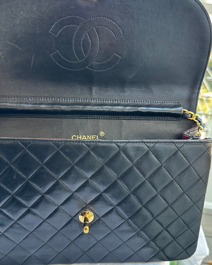 Chanel black leather flap turnlock bag