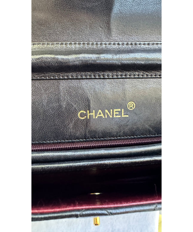 Chanel black leather flap turnlock bag