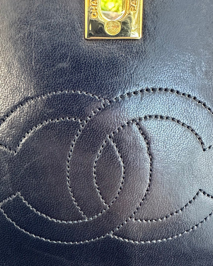 Chanel black leather flap turnlock bag