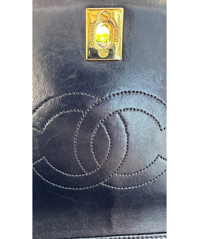 Chanel black leather flap turnlock bag