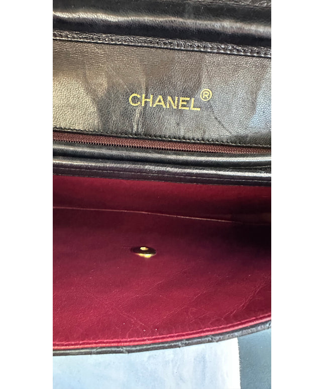 Chanel black leather flap turnlock bag