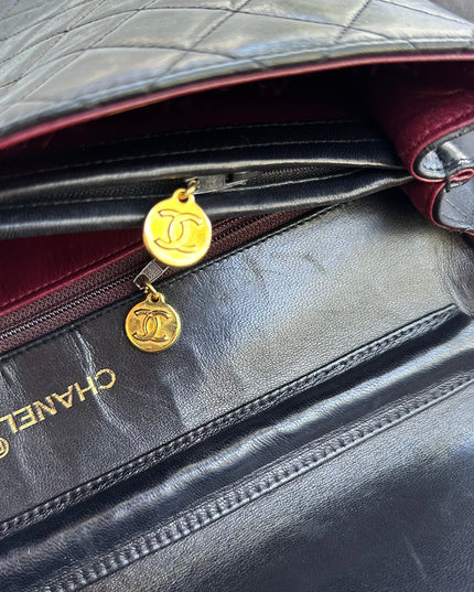 Chanel black leather flap turnlock bag