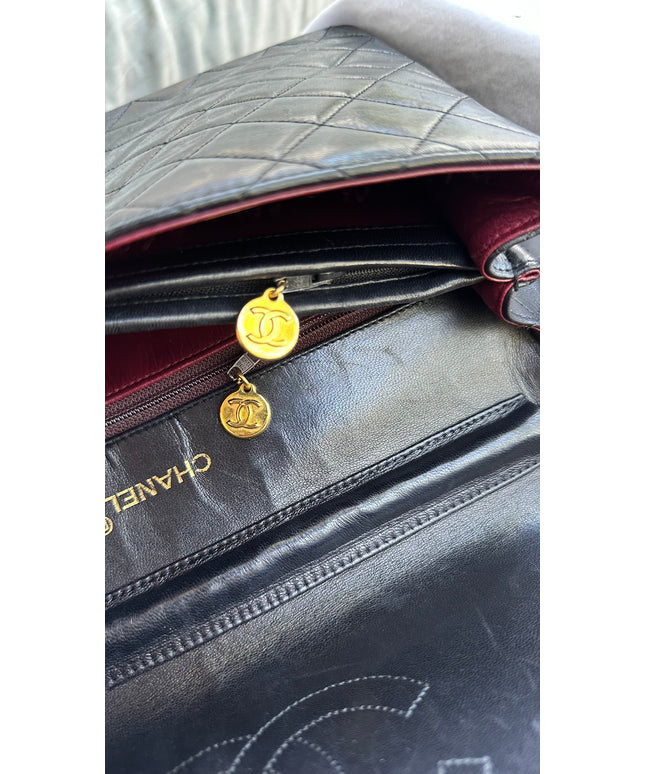 Chanel black leather flap turnlock bag